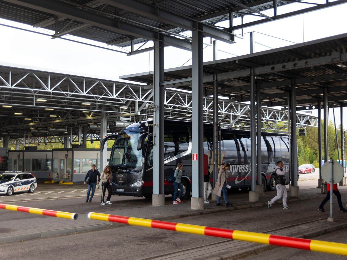 Russian passengers get off at the Finnish-Russian Vaalimaa border checkpoint in Virolahti, Eastern Finland, heading for passport control