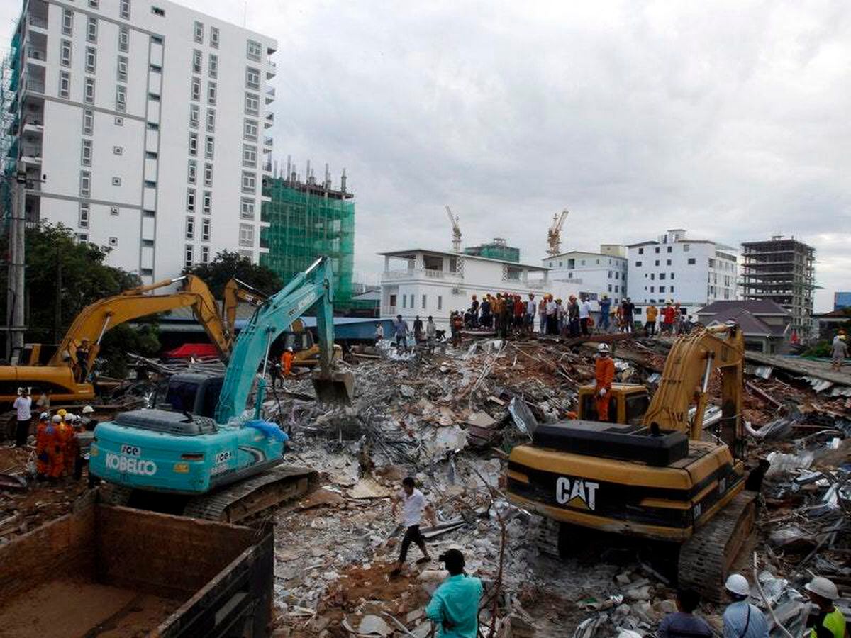 Rescuers search through rubble after deadly building collapse in ...