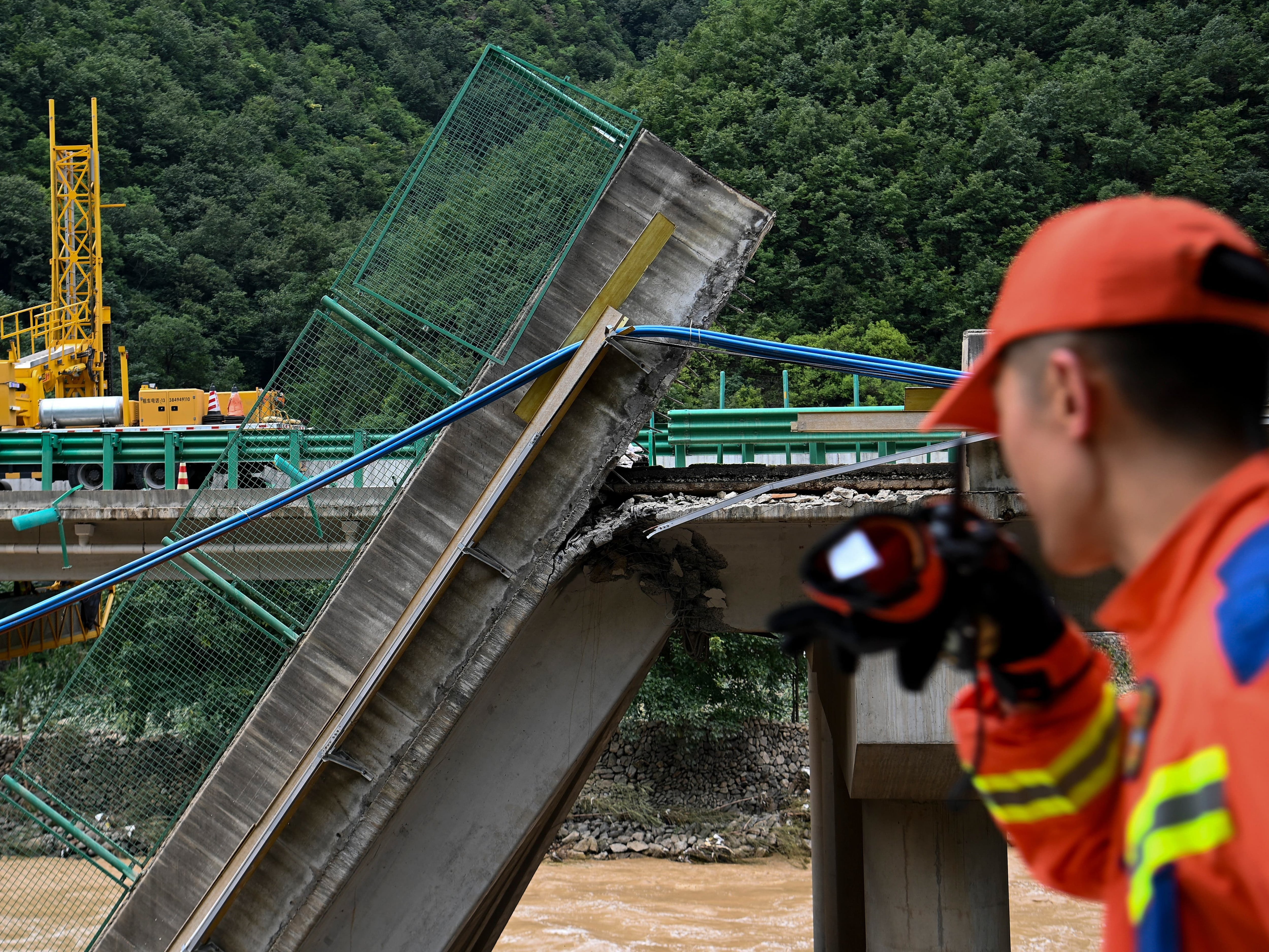 Death toll from China bridge collapse raised to 38 as two dozen still missing