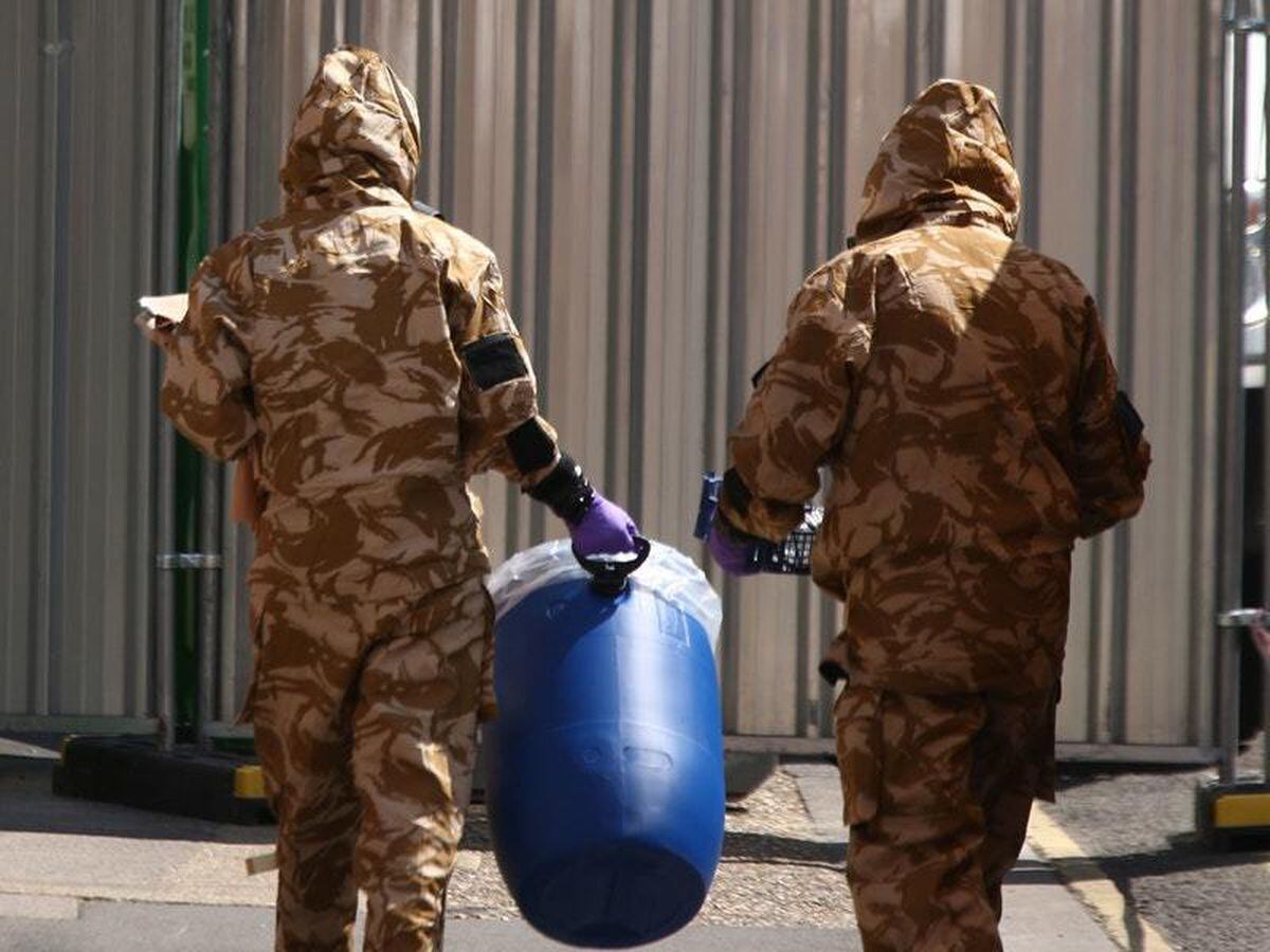 Investigators In Hazmat Suits Enter Novichok Victim’s Home 