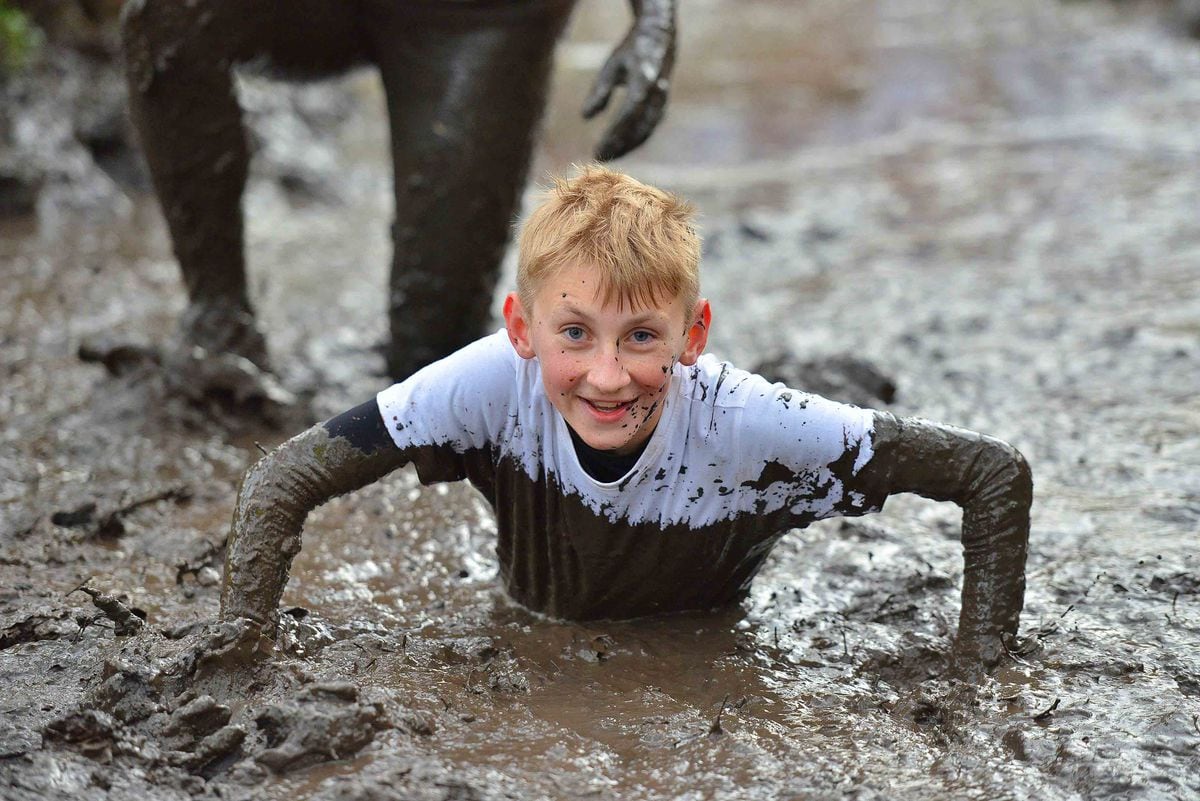 WATCH: A match made in mud as happy couple join in fun run | Express & Star