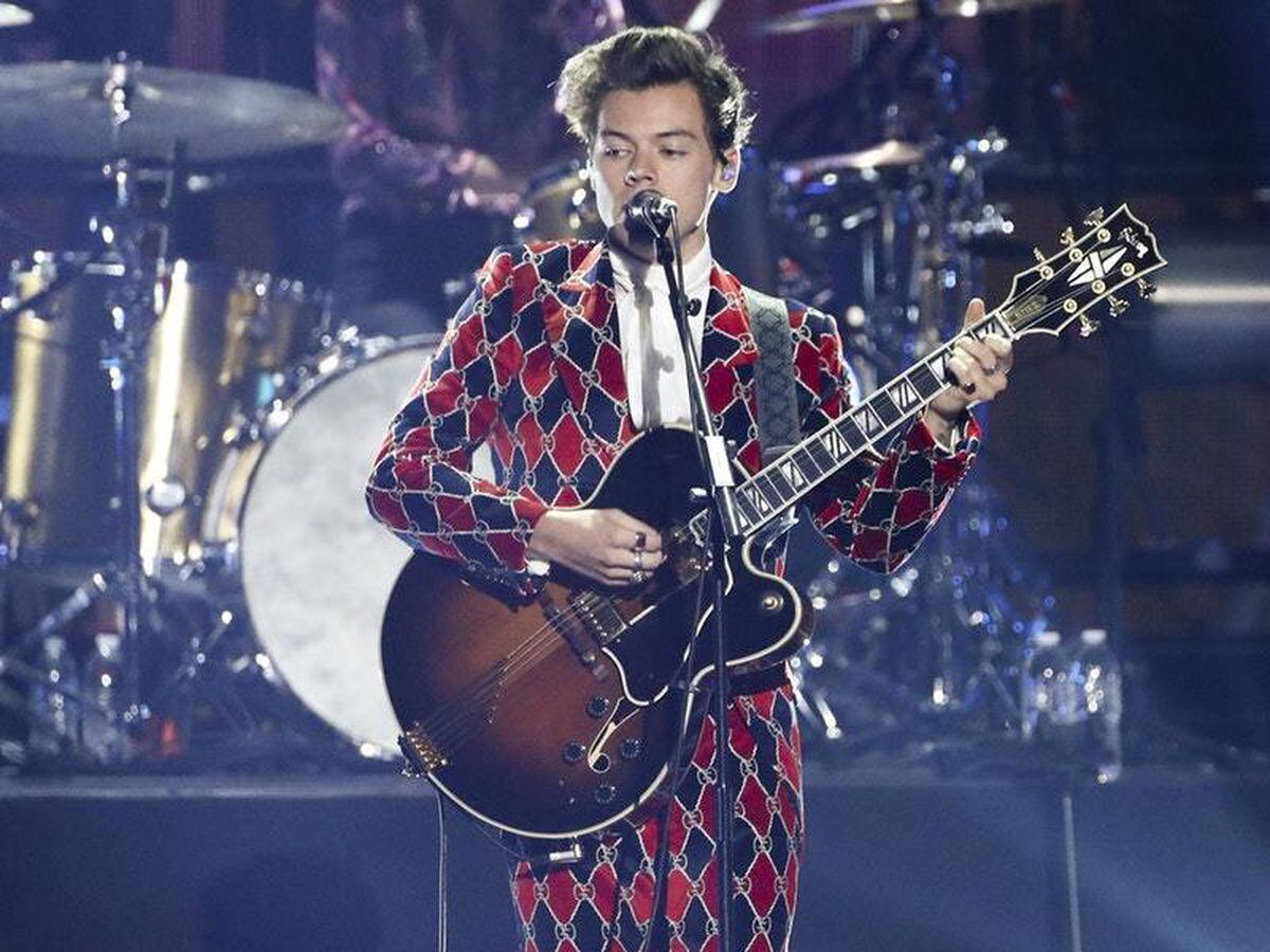 Harry Styles Divides Fans With Bright And Bold Suit For Solo 