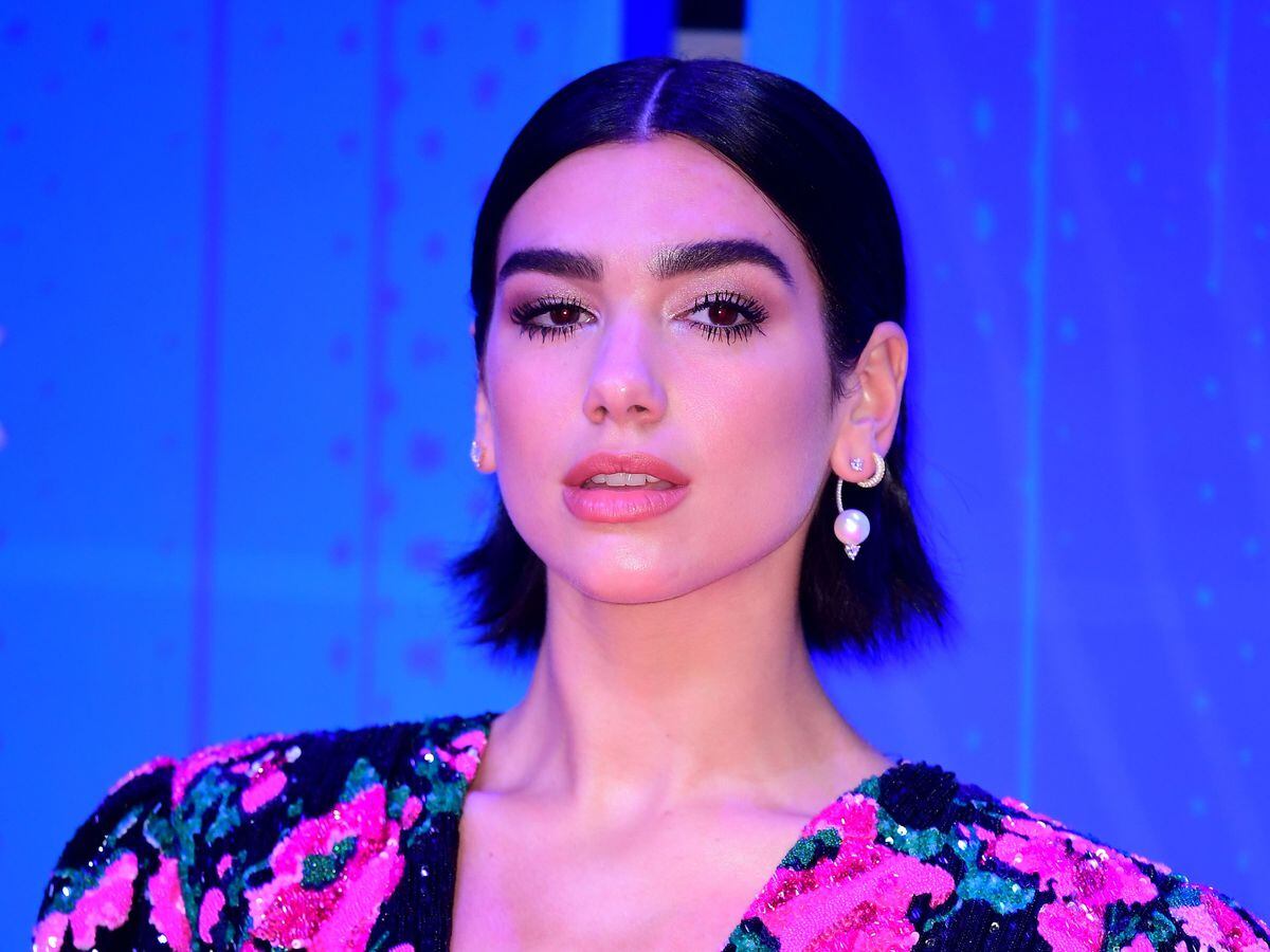 Dua Lipa gives nod to Amy Winehouse on Brit Awards red carpet | Express ...