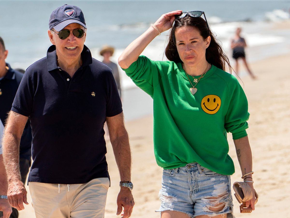 President Joe Biden and daughter Ashley walk on the beach