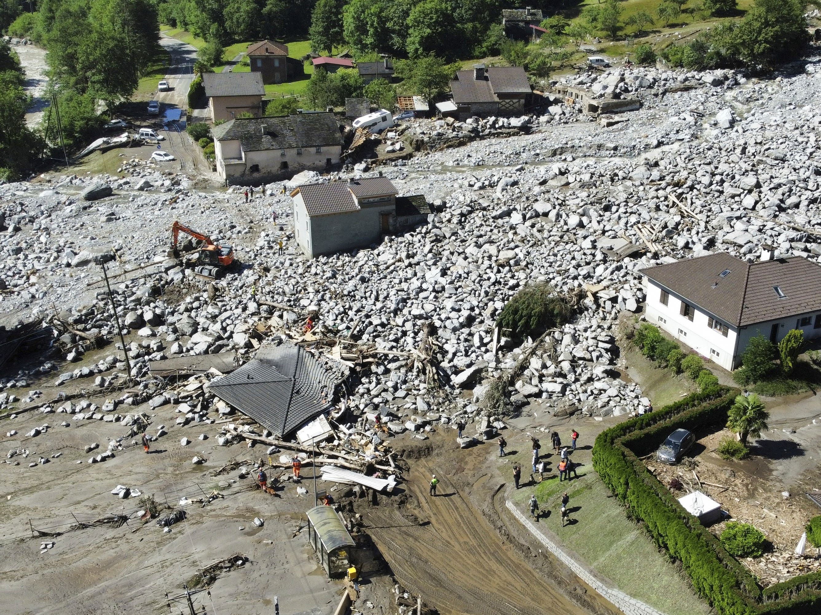 Three missing after landslide in Swiss Alps as heavy rains cause flash floods