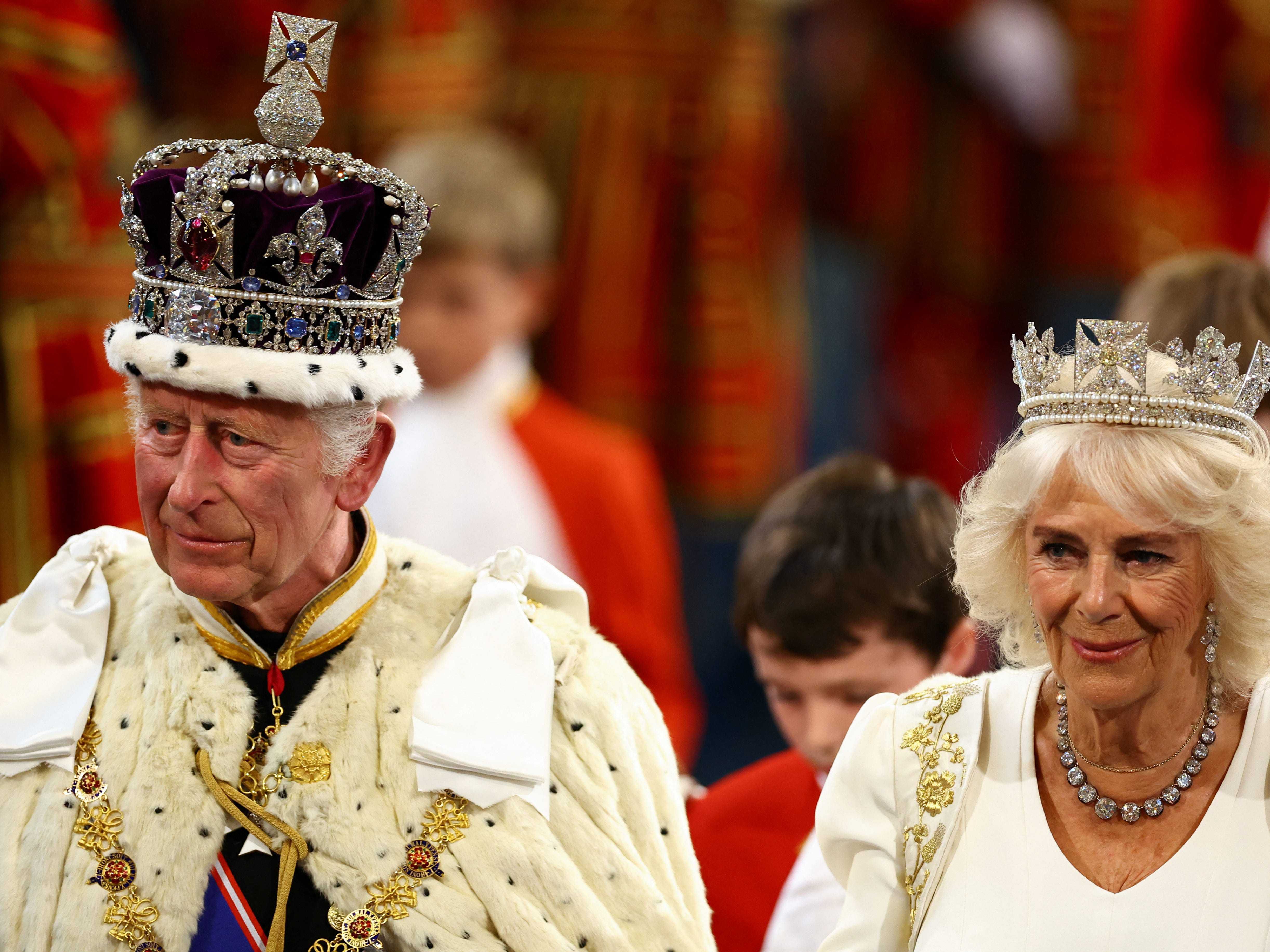 King opens Parliament supported by bandage-free birthday Queen