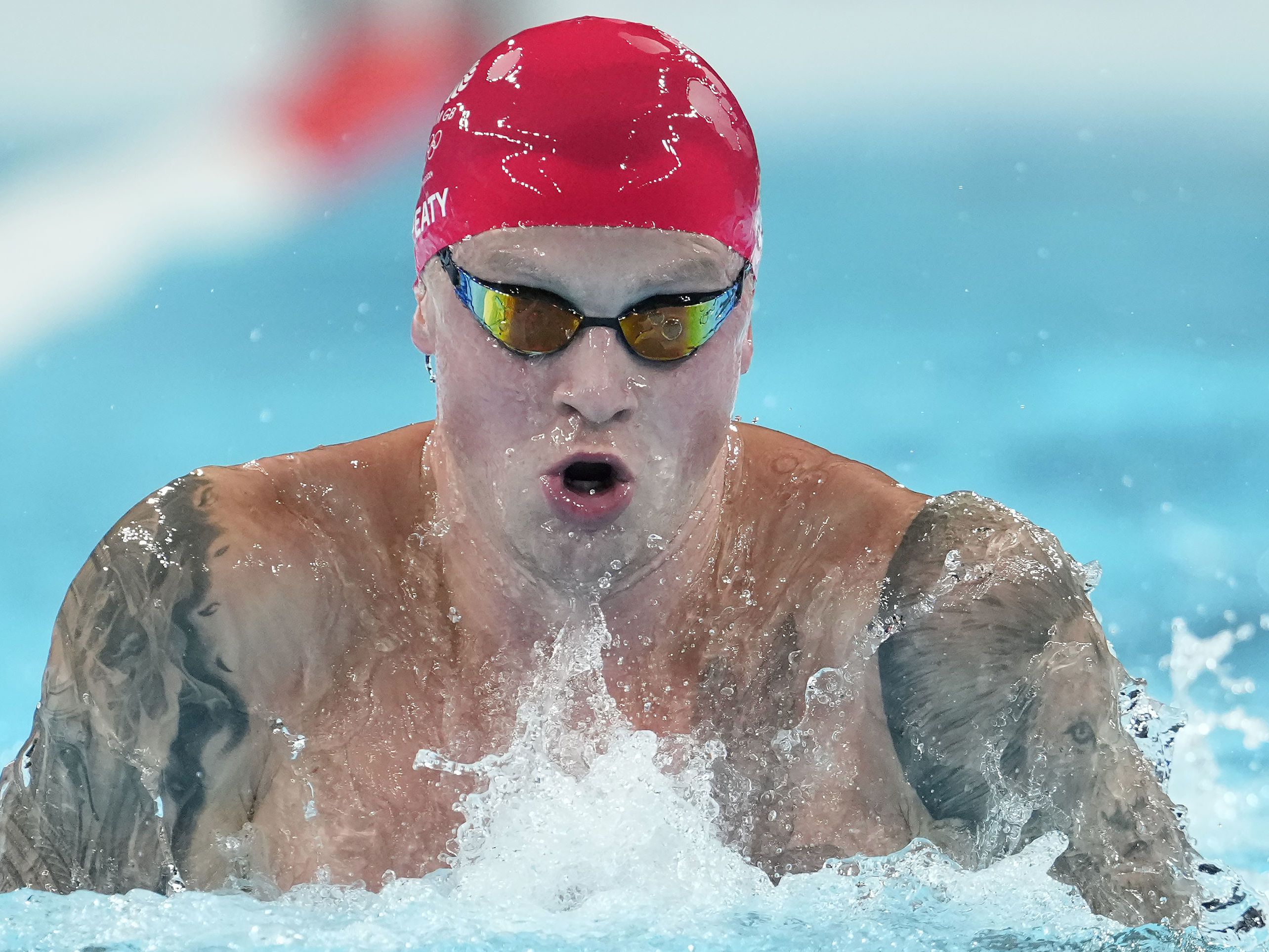 Adam Peaty qualifies fastest for 100m breaststroke final