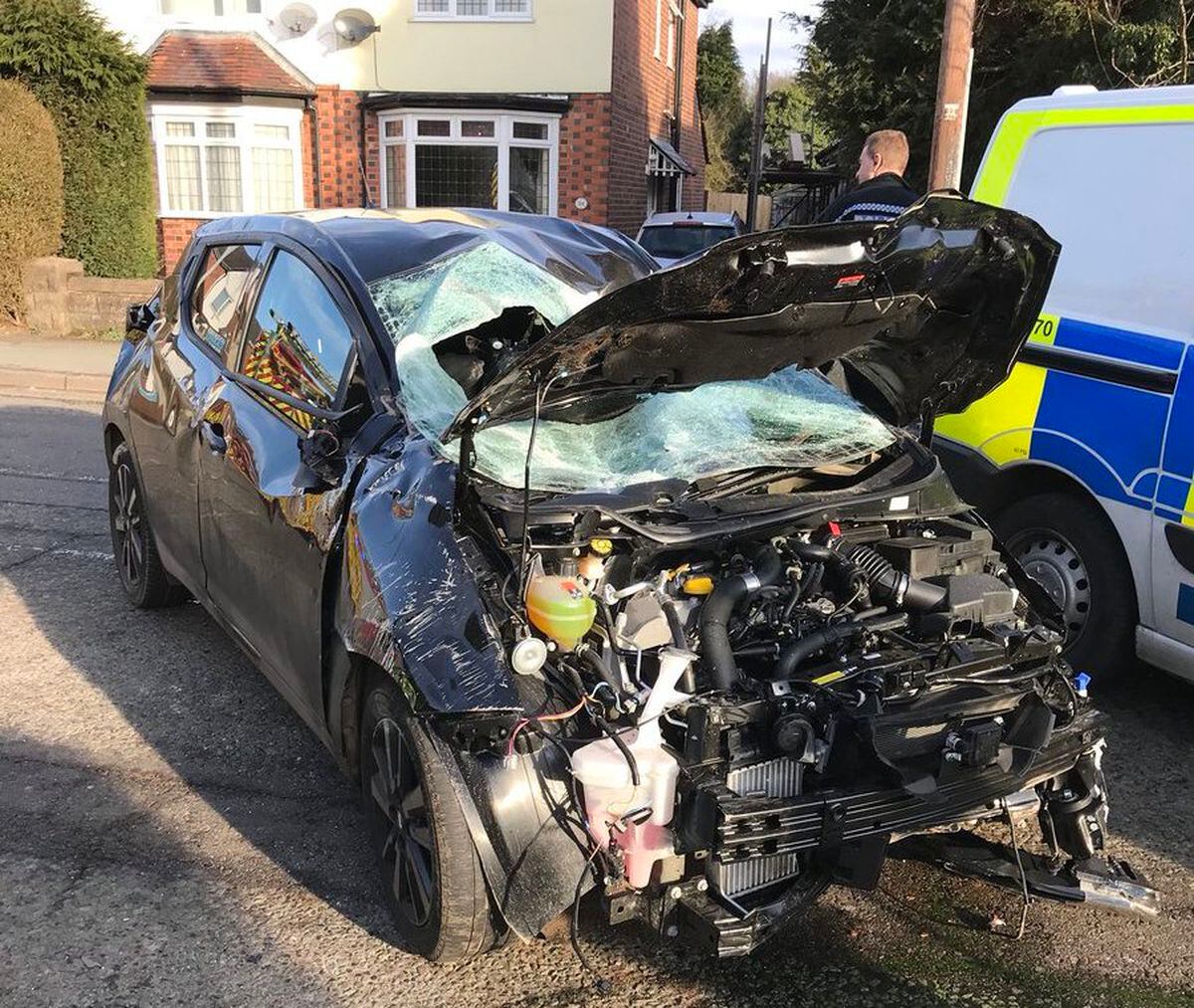 Driver taken to hospital as car crashes into garden wall ...