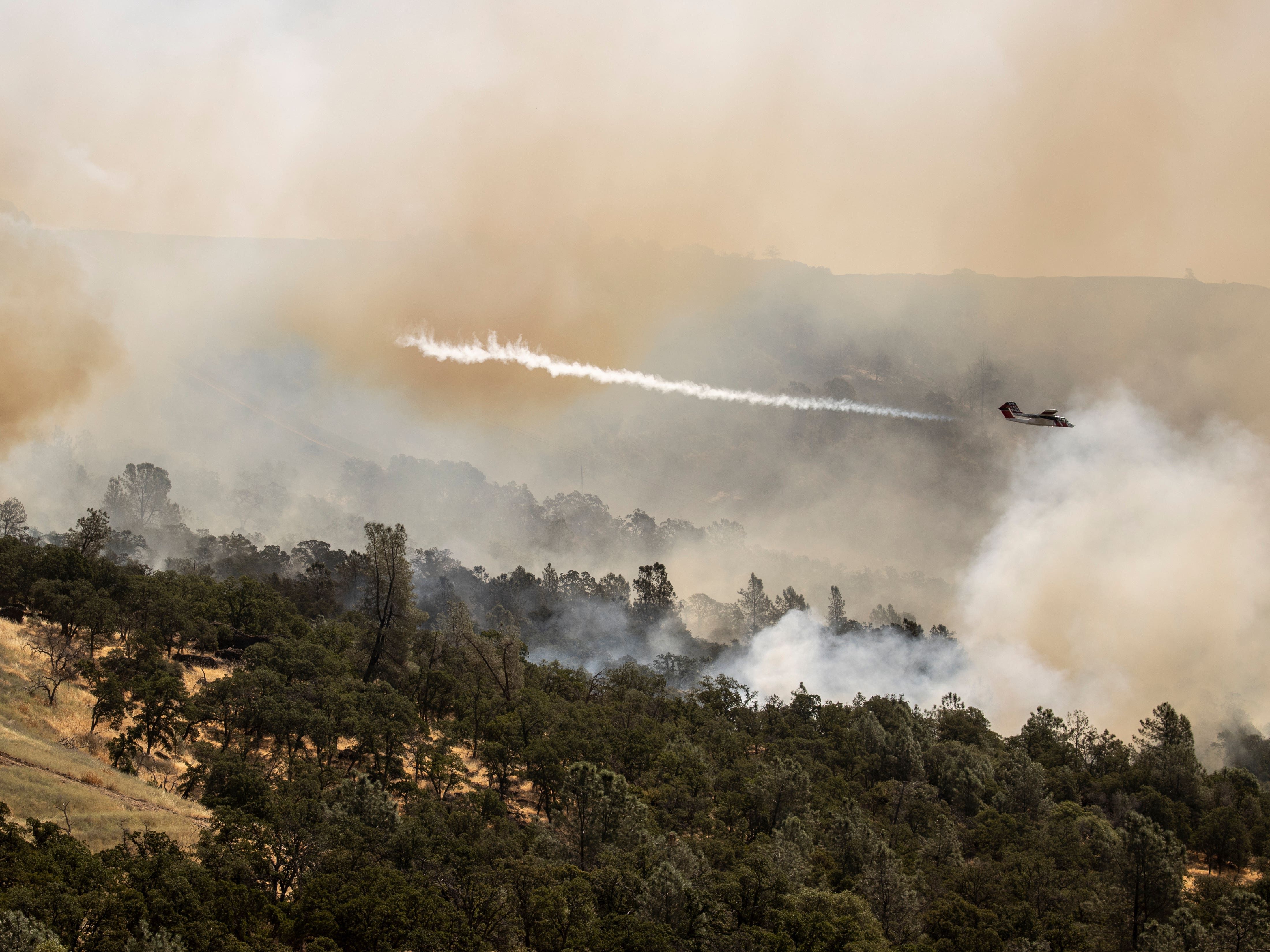 California wildfire does not grow but winds and hot weather could whip up flames