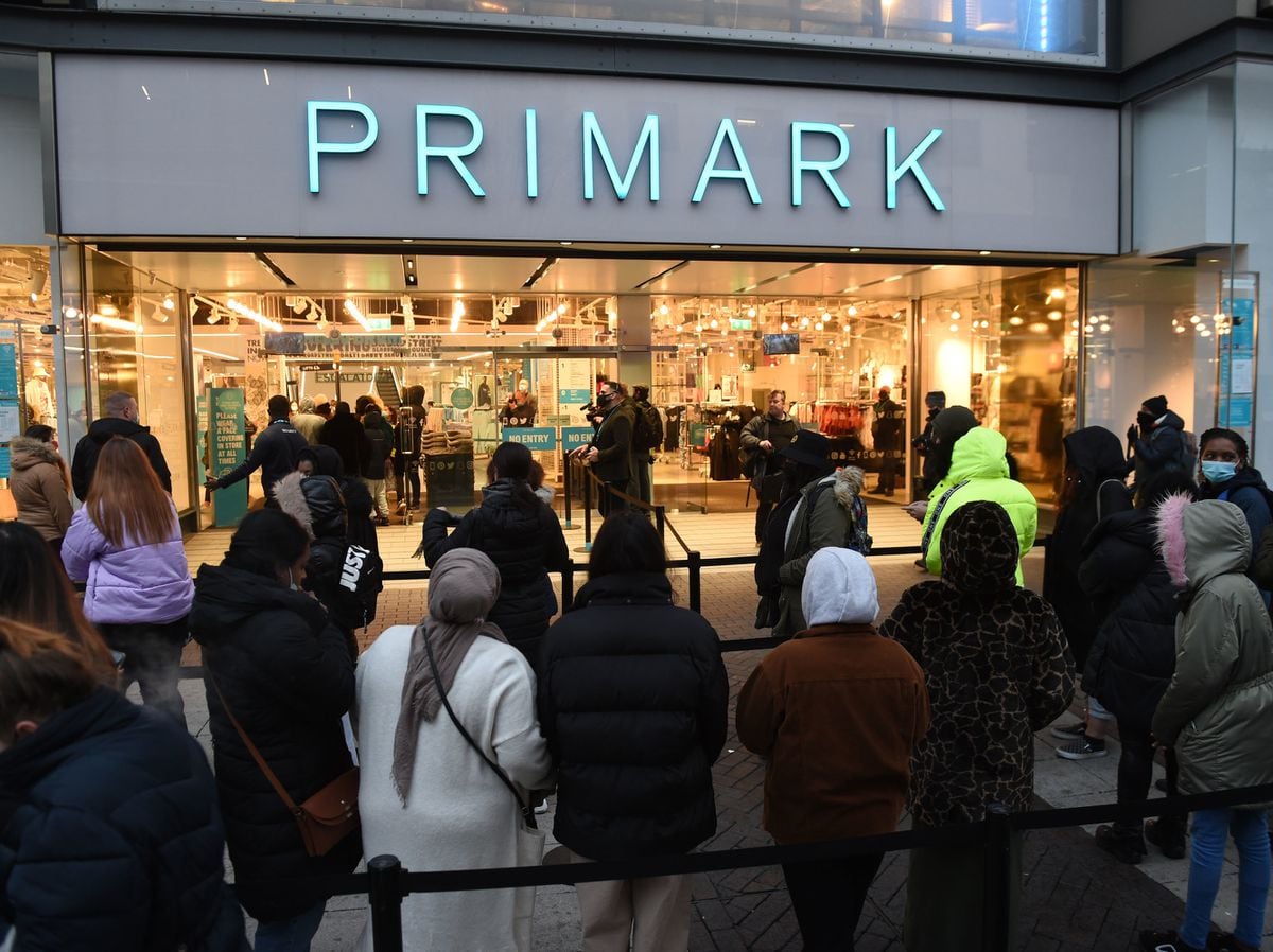 Eager shoppers form long queues as stores and pubs reopen across