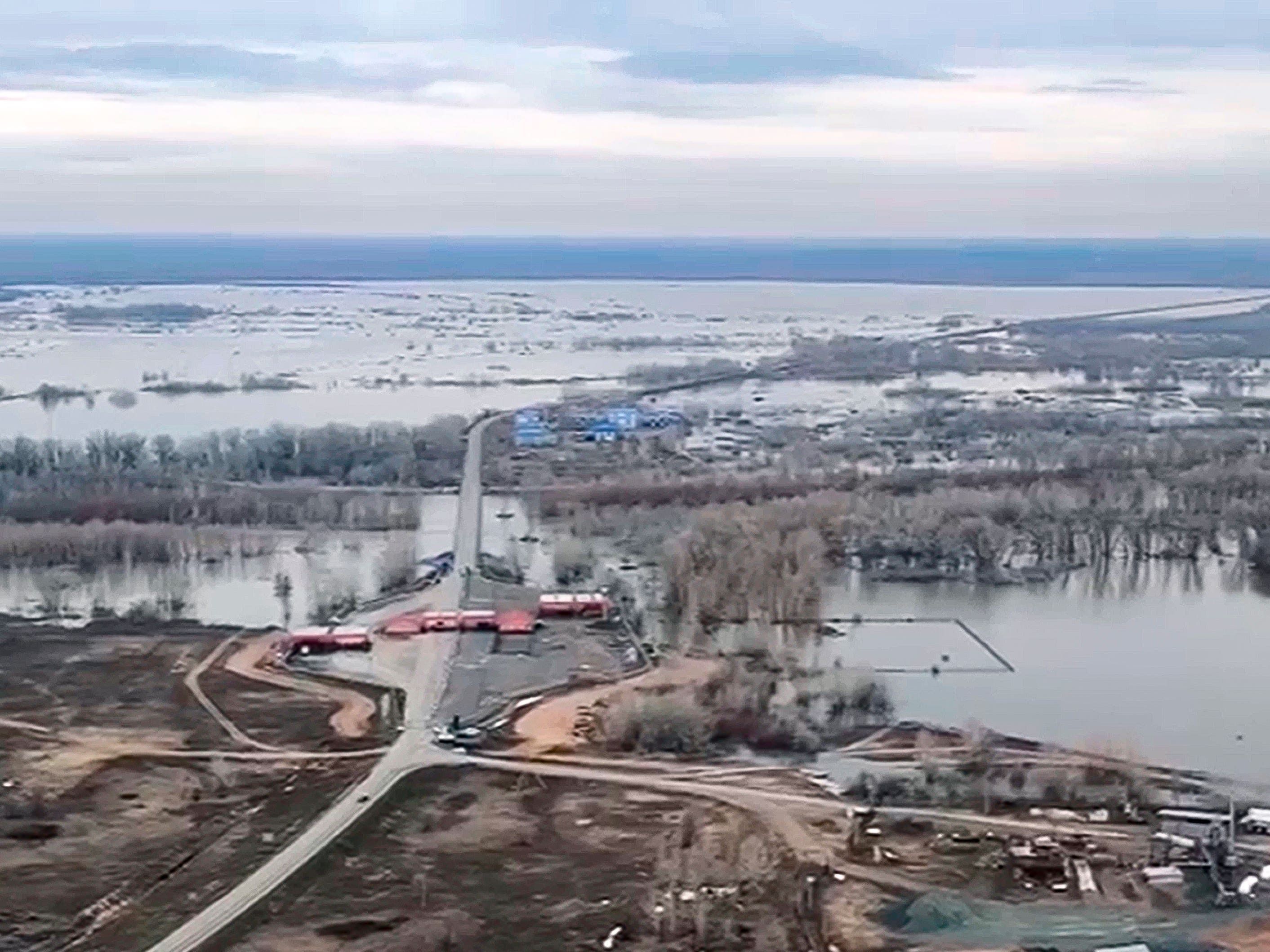 Water levels rise and homes flood in Russia following collapse of dam