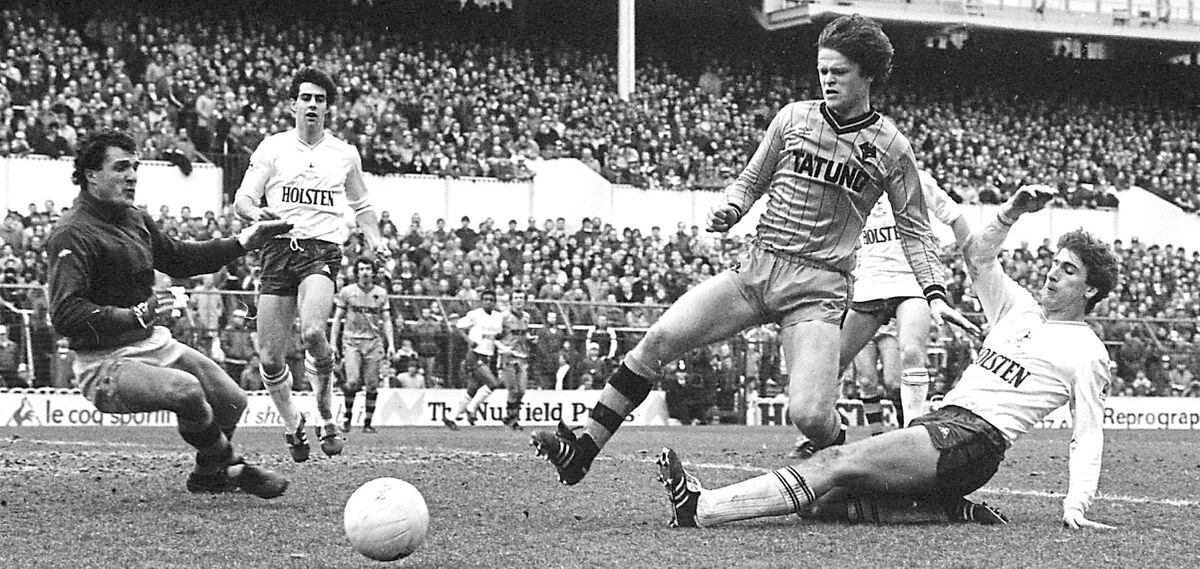 Defending the Wolves goal from Tottenham Hotspur’s Mark Falco (right) with the help of team-mate John Pender in Division One game at White Hart Lane