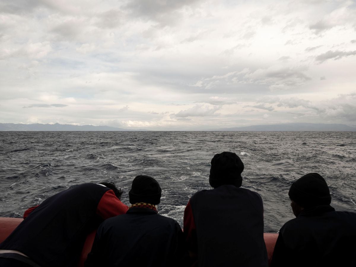 Migrants stand on deck of ocean viking rescue ship