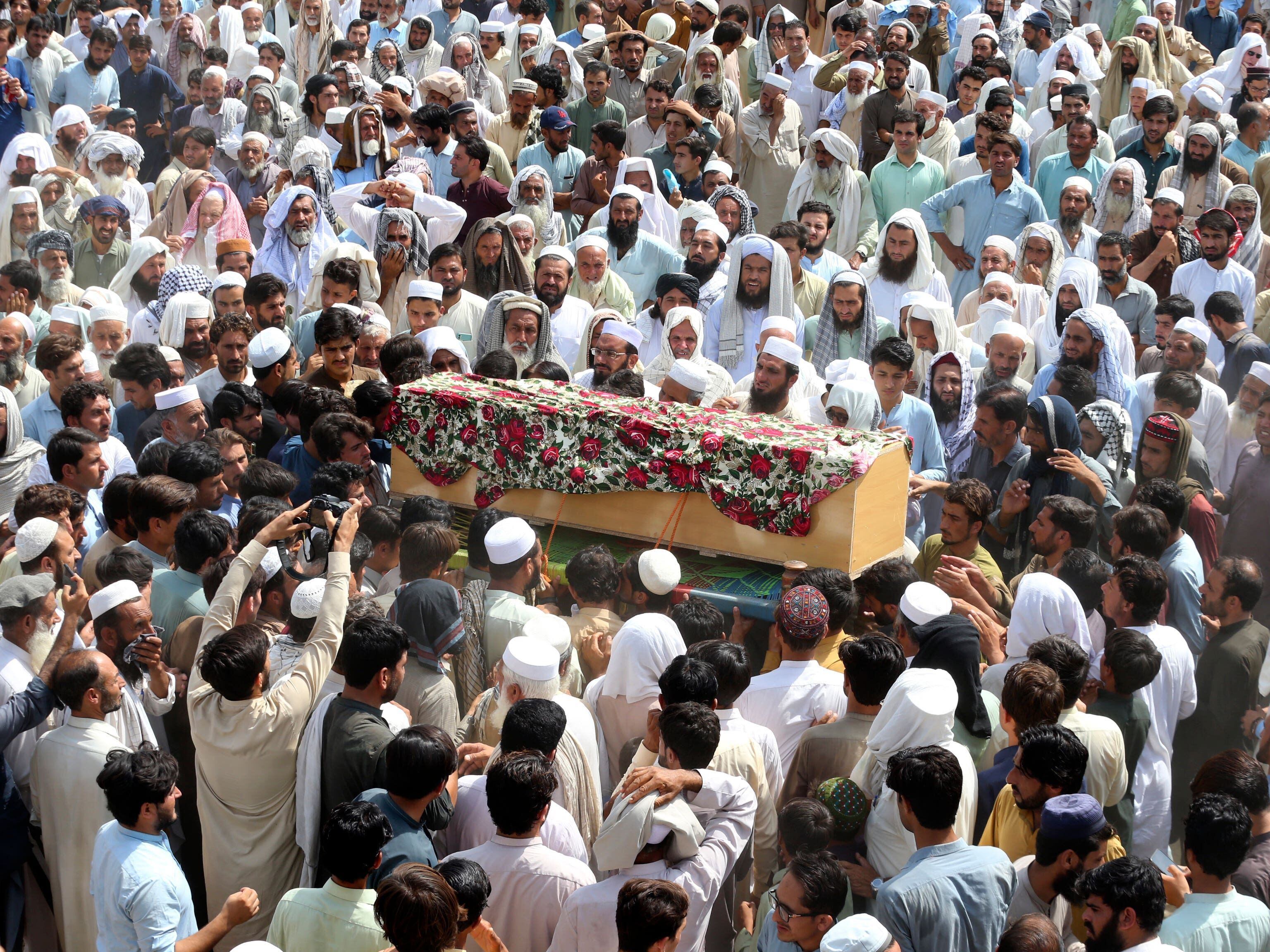 Funerals held after 54 die in bombing at election rally for pro-Taliban cleric