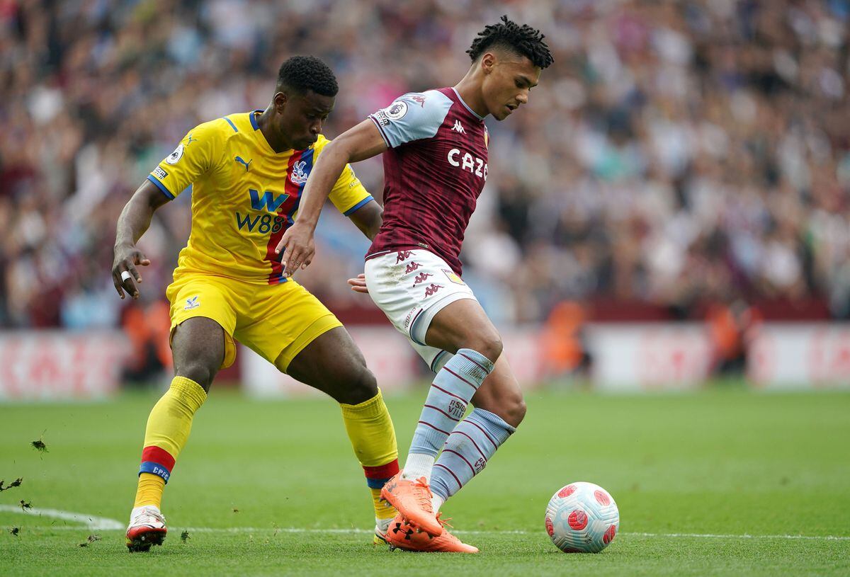 Crystal Palace's Marc Guehi (left) and Aston Villa's Ollie Watkins battle for the ball during the Premier League match at Villa Park, Birmingham. Picture date: Sunday May 15, 2022. PA Photo. See PA story SOCCER Villa. Photo credit should read: Zac Goodwin/PA Wire...RESTRICTIONS: EDITORIAL USE ONLY No use with unauthorised audio, video, data, fixture lists, club/league logos or "live" services. Online in-match use limited to 120 images, no video emulation. No use in betting, games or single club/league/player publications..