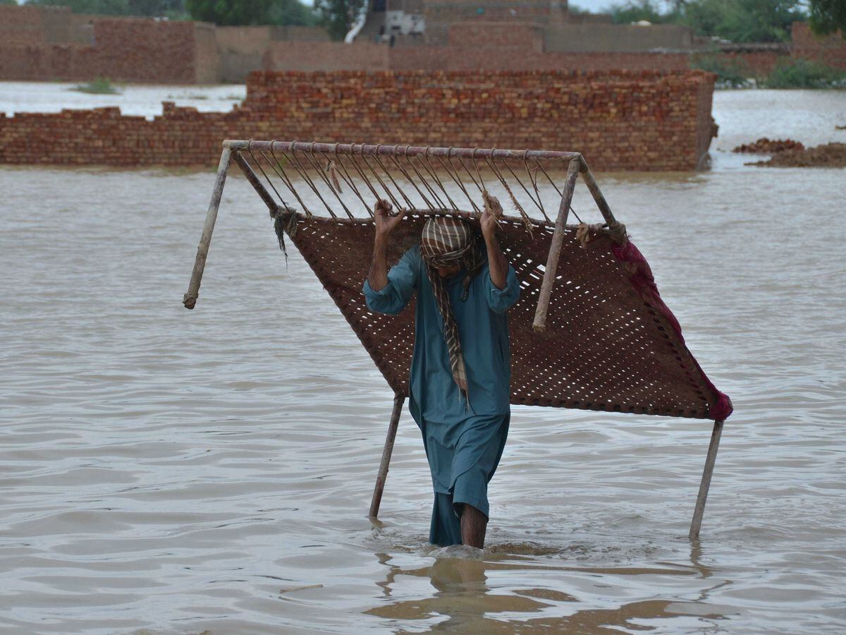 A man salvages a crib from his flood-hit home in Jaffarabad, Pakistan's southwestern Balochistan province.