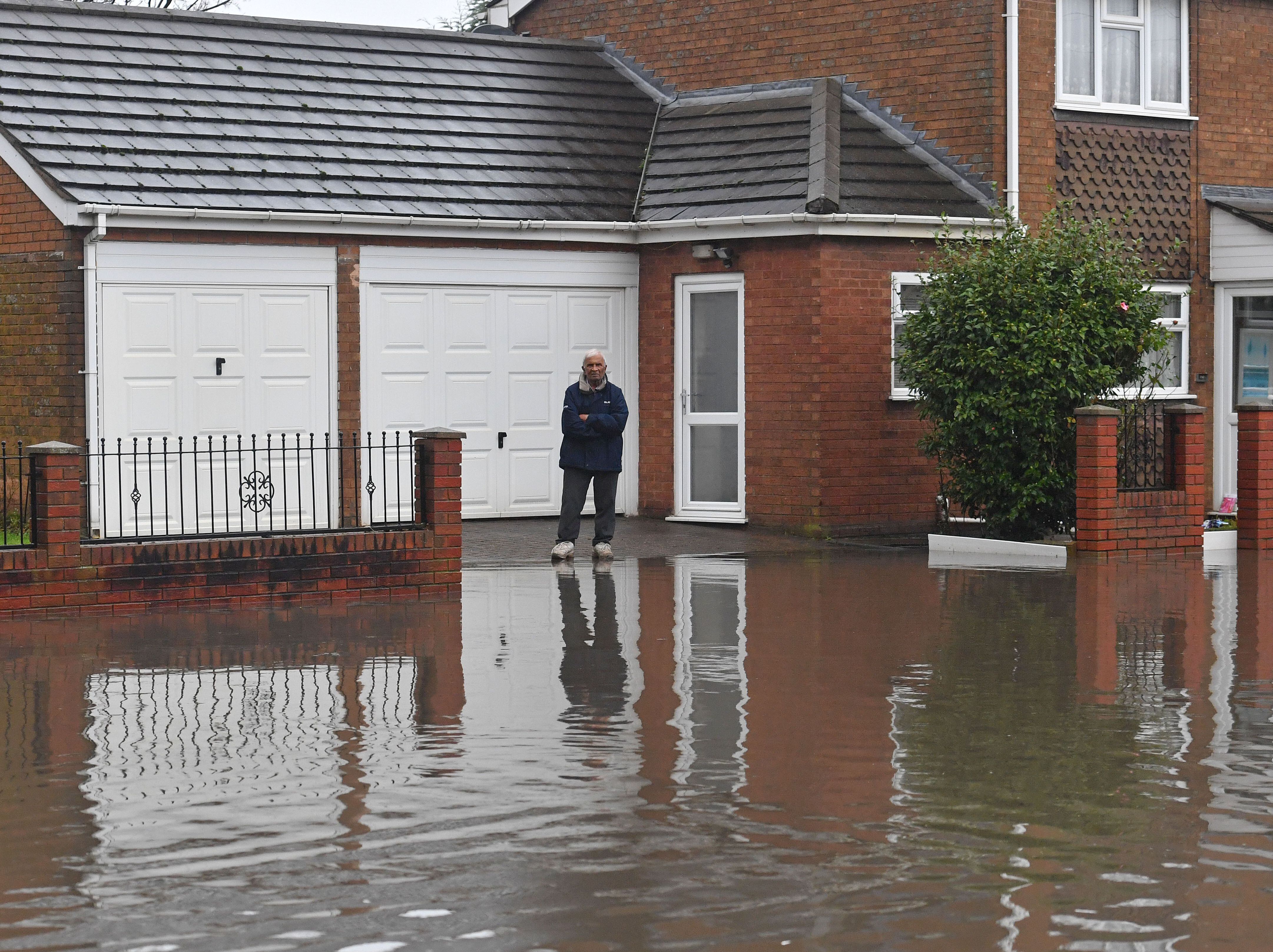 Blocked drain blamed as heavy rain brings yet more flooding to West Bromwich street

 