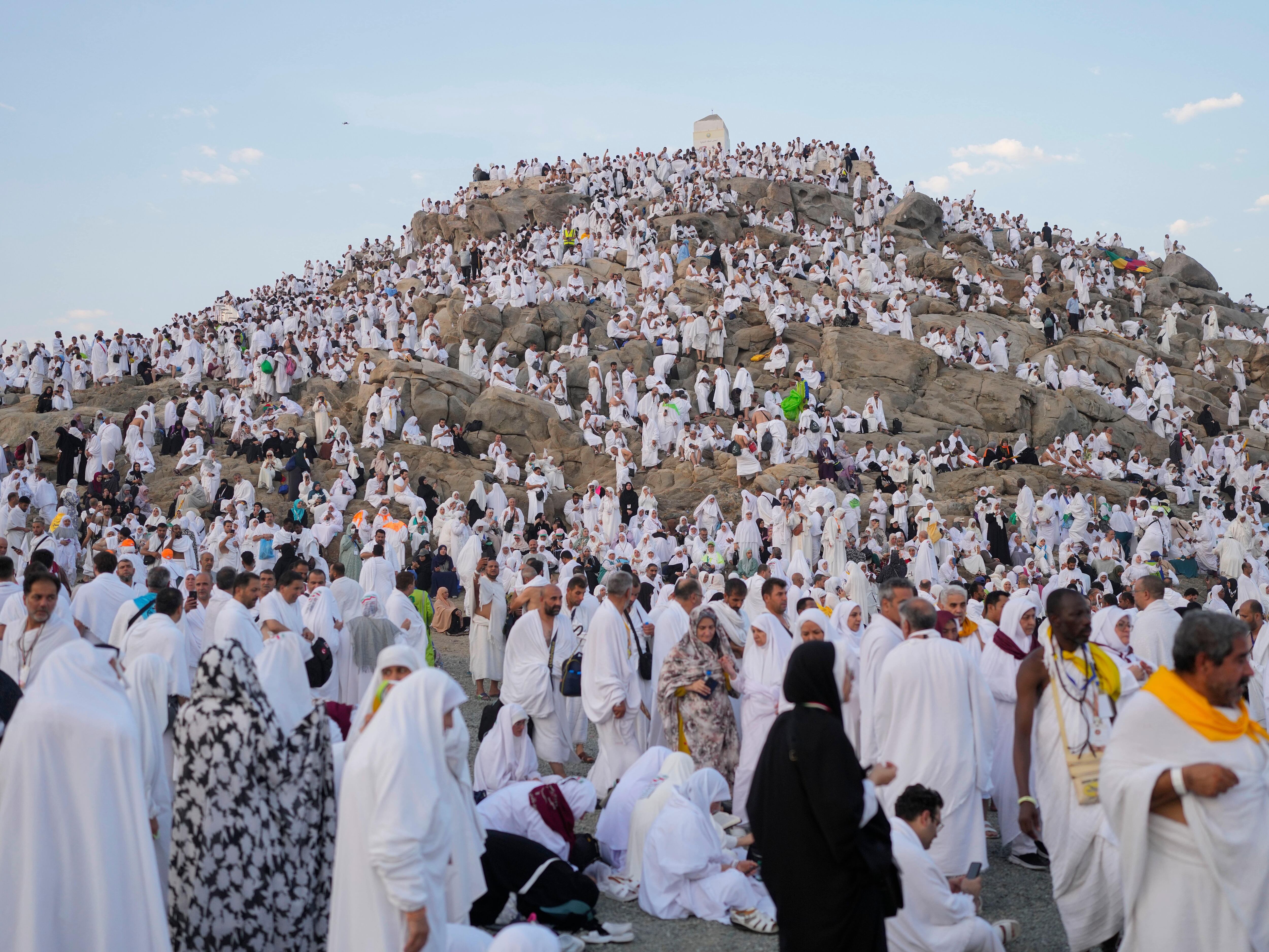 Muslim pilgrims converge at Mount Arafat for worship as Hajj reaches its peak