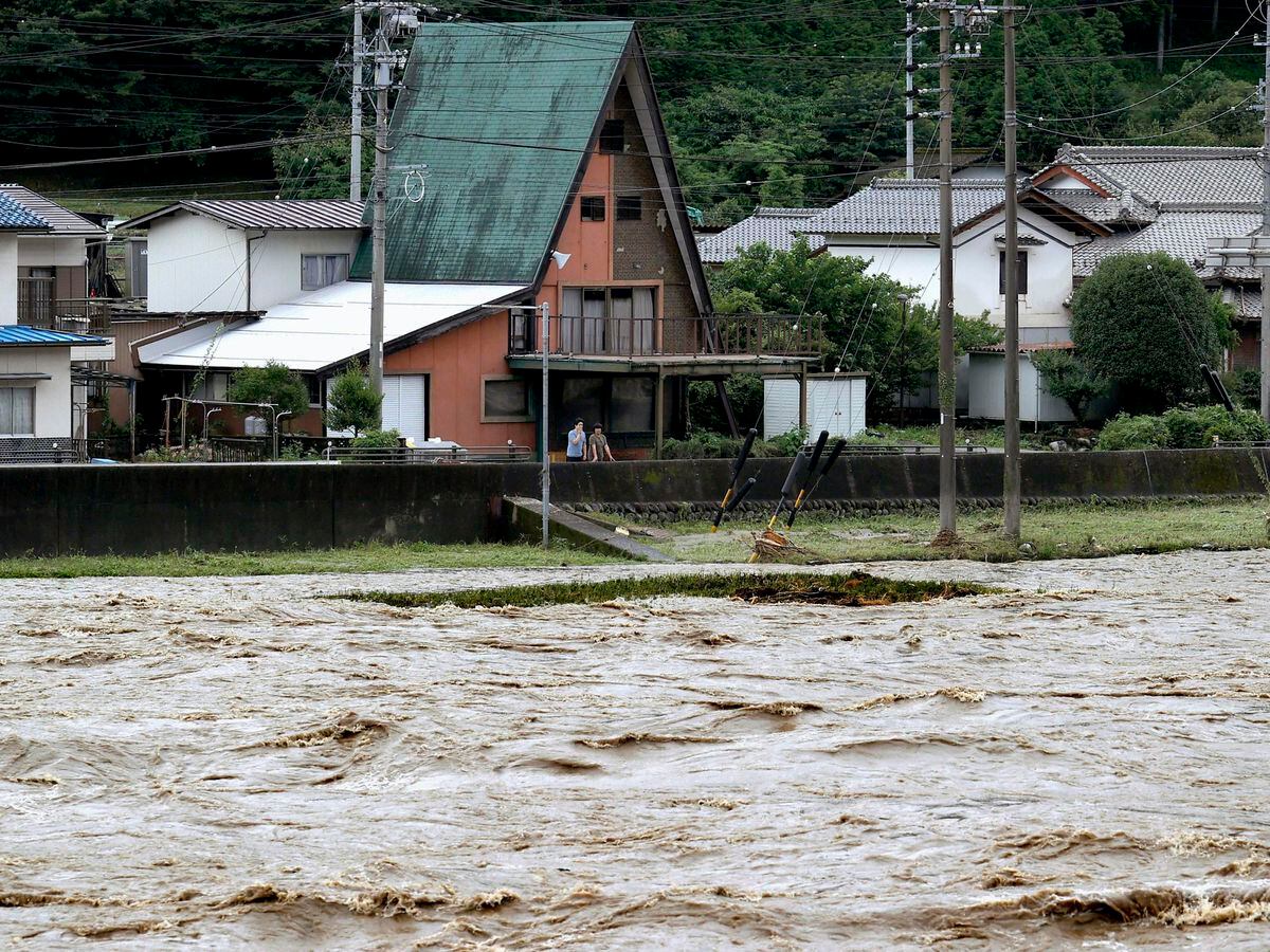 Japan battered by more heavy rain as floods death toll nears 60