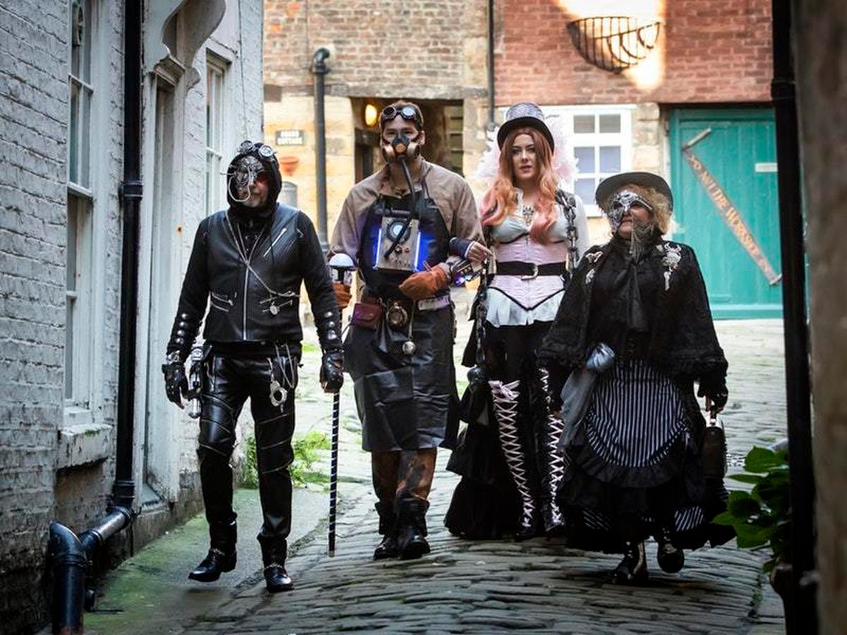 Paddleboarders celebrate Whitby Goth Weekend with witch costumes | Express  & Star