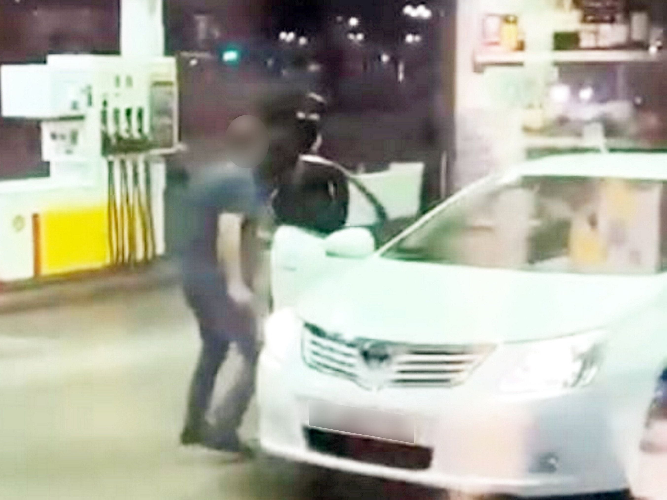 Watch: Terrifying moment driver is targeted by machete gang at petrol station