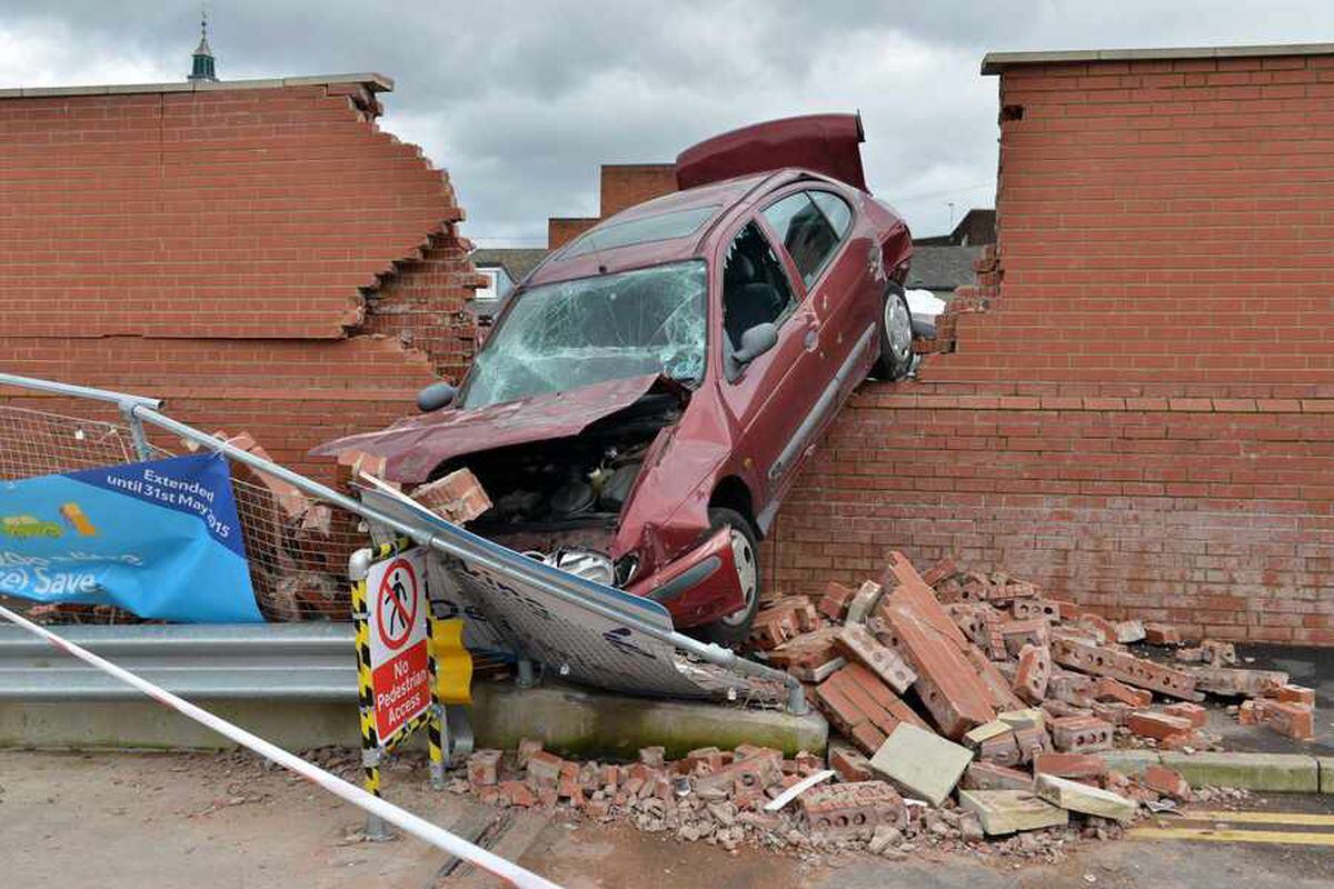 IN PICTURES: Car smashes through brick wall in town centre | Express & Star