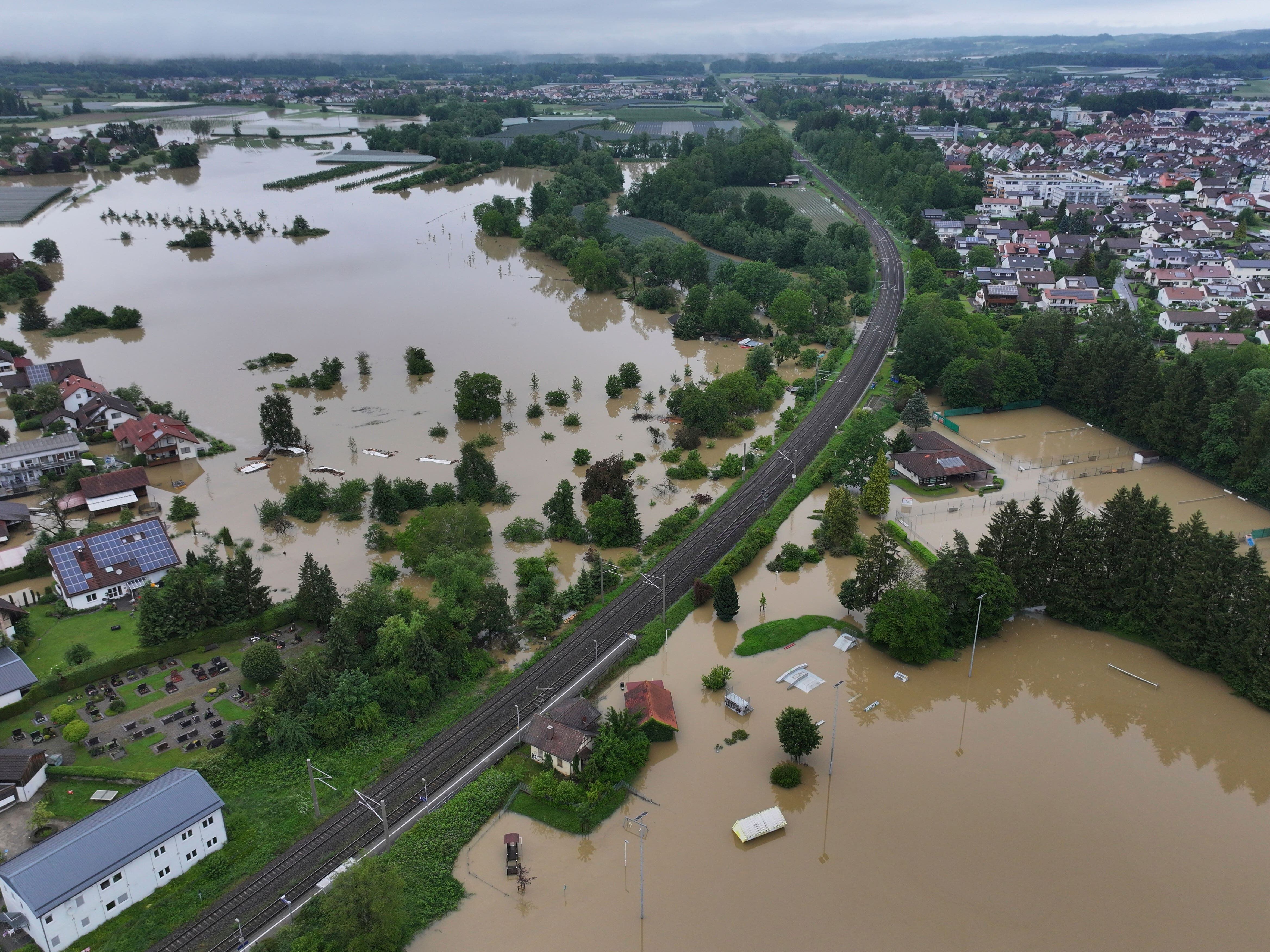 Firefighter dies and train derails amid heavy rain and flooding in Germany