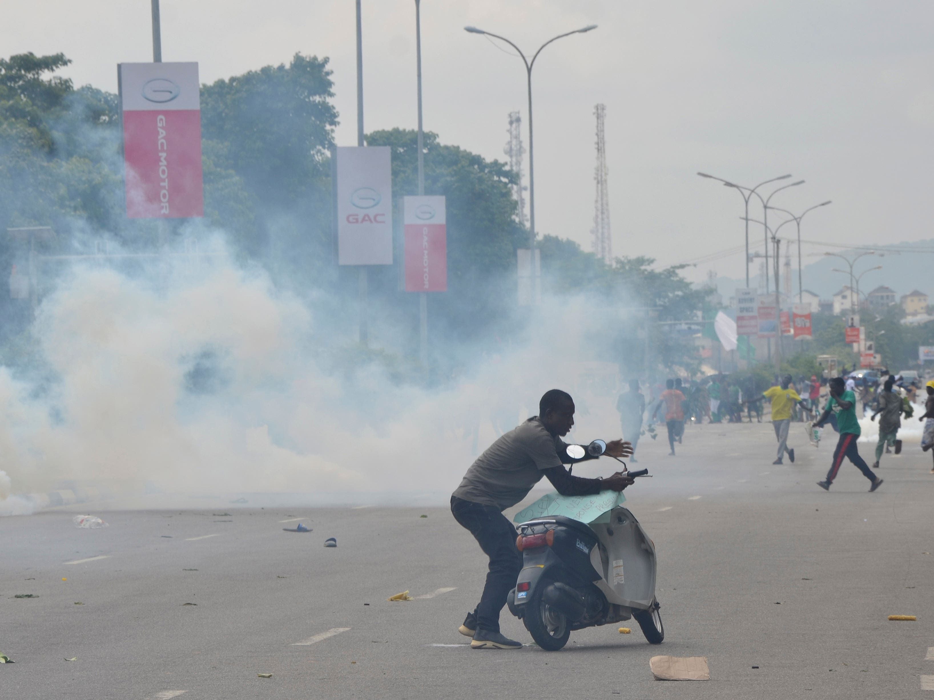 Nigerian leader demands end to protests over hardship which have turned violent