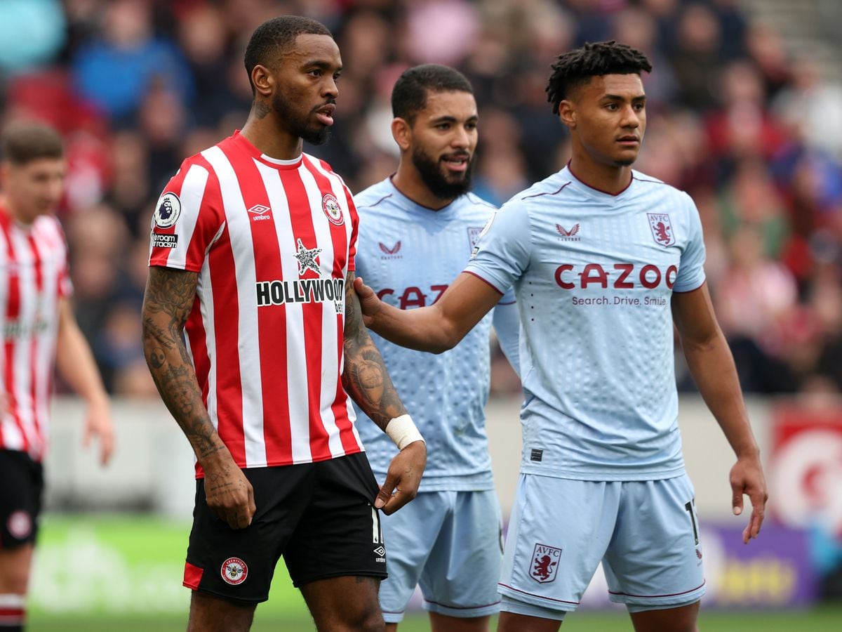  Ollie Watkins and Ivan Toney flank Tyrone Mings of England during a soccer match.