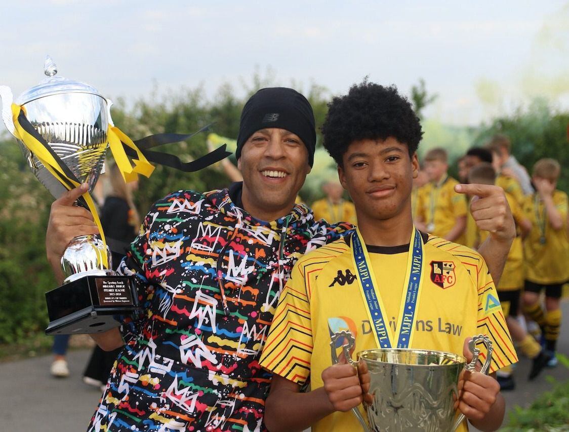 Young footballer celebrates historic treble win and continues to impress top clubs