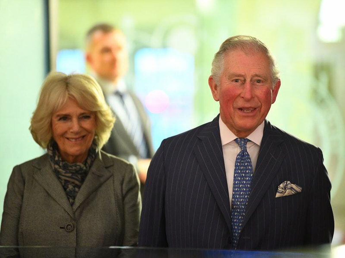 Charles and Camilla snapped in swimming costumes on Barbados beach by ...