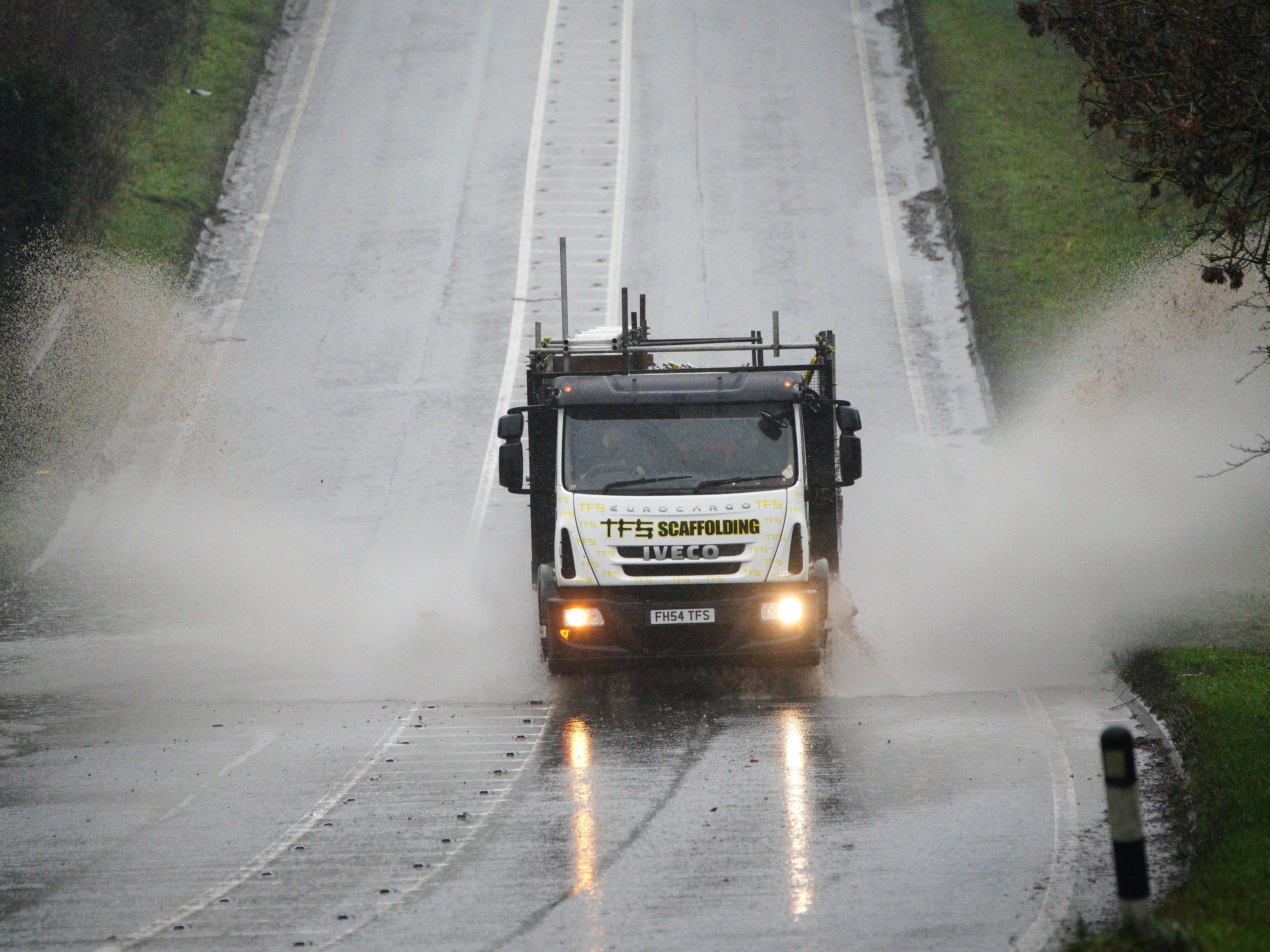 Nearly 30 flood warnings issued as UK faces heavy rain but snow risk lessens