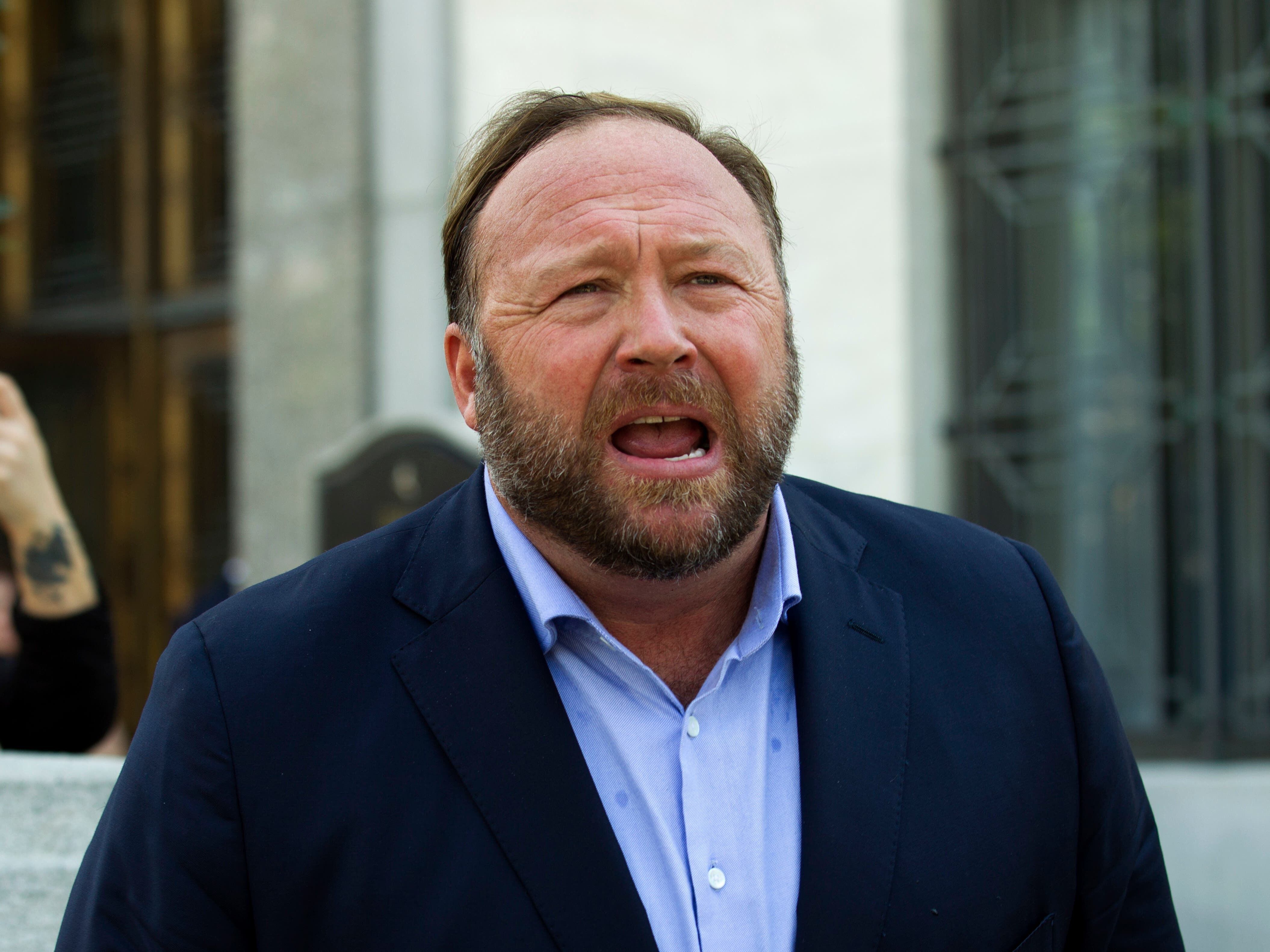 Conspiracy website Infowars files for bankruptcy as founder faces libel lawsuits