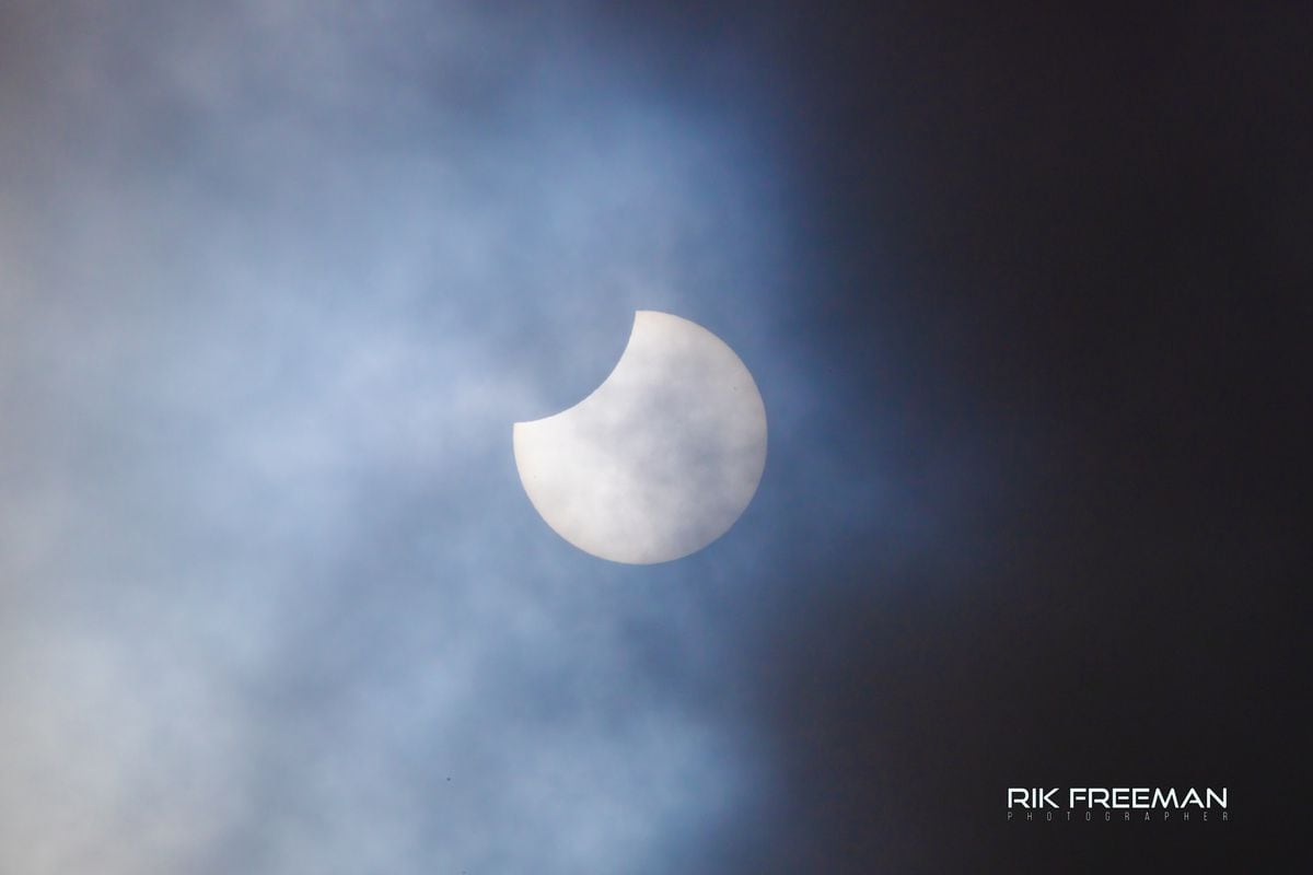 Lucky residents defy clouds to capture stunning partial solar eclipse