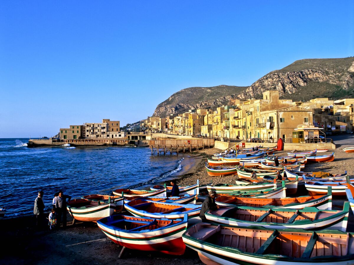 Seven missing after sailboat carrying UK tourists sinks in storm off Sicily