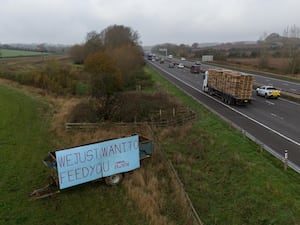 A sign in a field by the M40 near Warwick protesting against the changes to inheritance tax rules