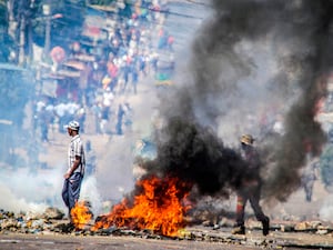 A barricade burns in Maputo