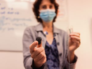 Professor Rebecca Fitzgerald holding her invention, the capsule sponge test.