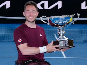 Alfie Hewett celebrates with the trophy after defeating Tokito Oda