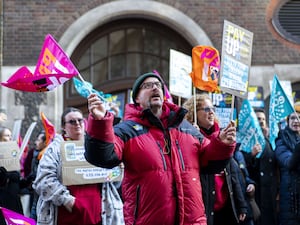 Members of the National Education Union hold a rally outside the Department for Education