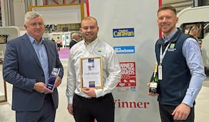 Salop Leisure’s joint managing director, Mike Harris (left) and touring caravan and motorhome sales assistants, James Yewbrey and Dan Taylor, with the award