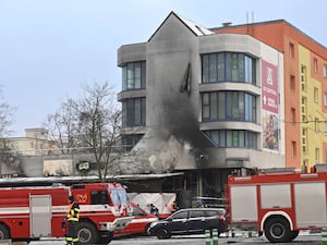 Emergency services attend the scene of a fire at a restaurant in Most