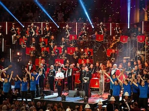 A group of musicians performing on stage