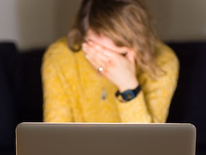 A woman looking stressed