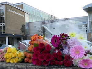 Floral tributes left outside All Saints Catholic High School, Sheffield, where 15-year-old Harvey Willgoose was killed