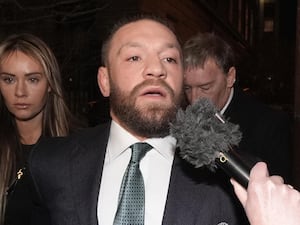 Conor McGregor and partner Dee Devlin leave the High Court in Dublin