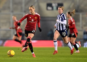 Manchester United's Millie Turner passes the ball during the Adobe Women's FA Cup fourth round match at Leigh Sports Village