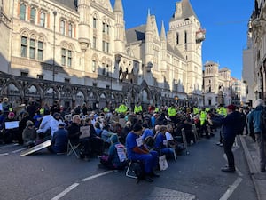 Protesters outside the Royal Courts of Justice in London