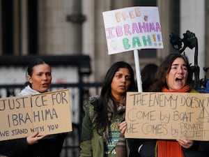 Protesters outside the Royal Courts of Justice in London