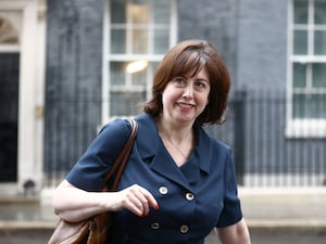 A woman in a blue dress in Downing Street